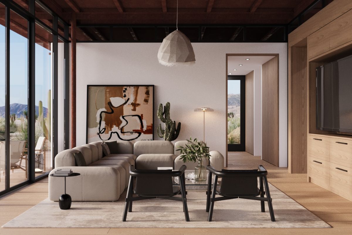 A living room with a pale sectional, abstract art and the desert through tall glass