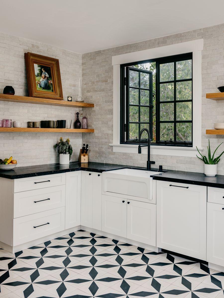 After: white cabinets, open shelves and black and white cement tile